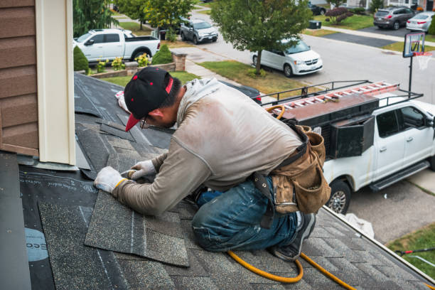 Professional Roof Replacement technician working in Flushing, NY